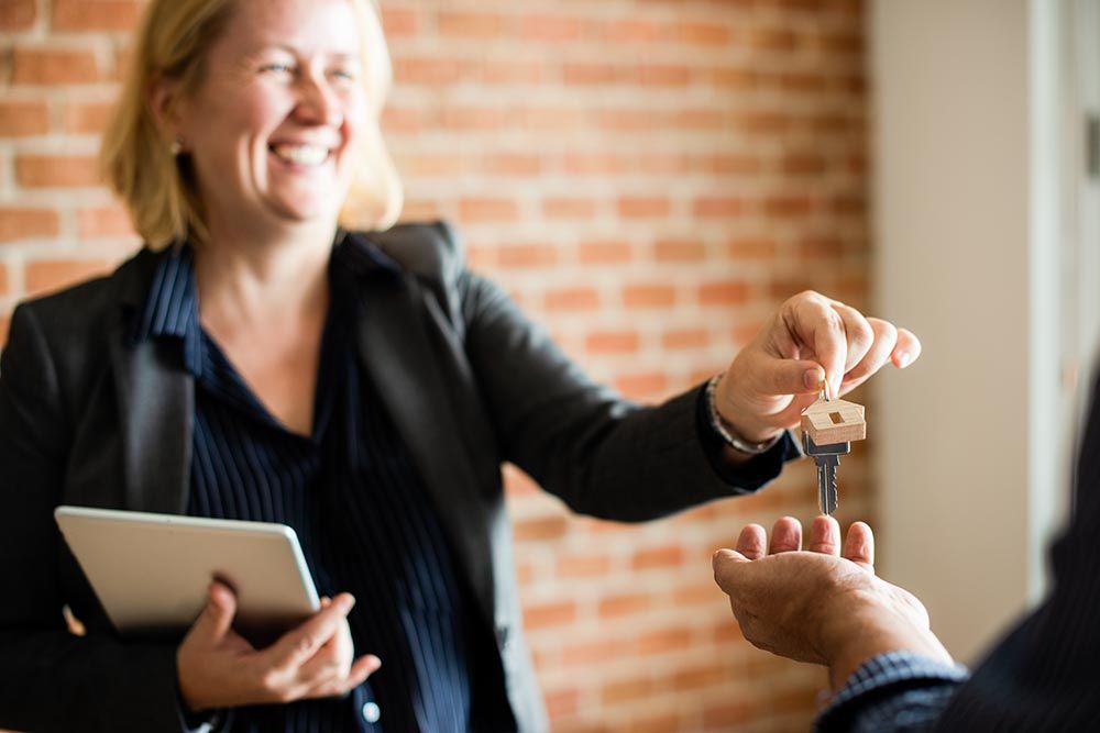 Estate agent handing over the keys